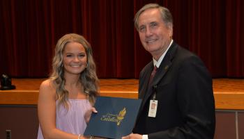 Student receives certificate from SCC President