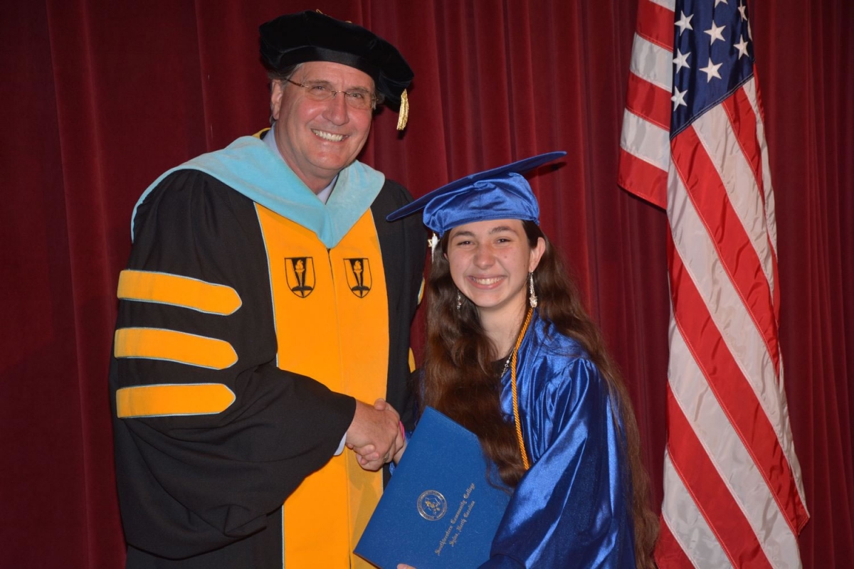 Macon County graduate Amanda Menichello (right) with Dr. Don Tomas.