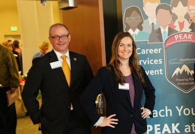 Mike Despeaux and Jodie Waldroup from Career Services stand proudly at a job fair