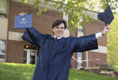 Male graduate celebrates his accomplishment