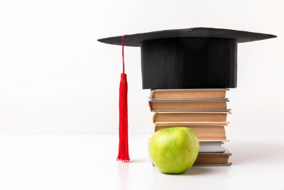 graduation cap and books
