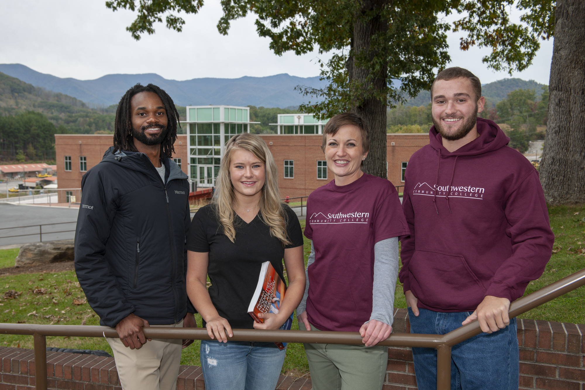 Four SCC students pose outdoors