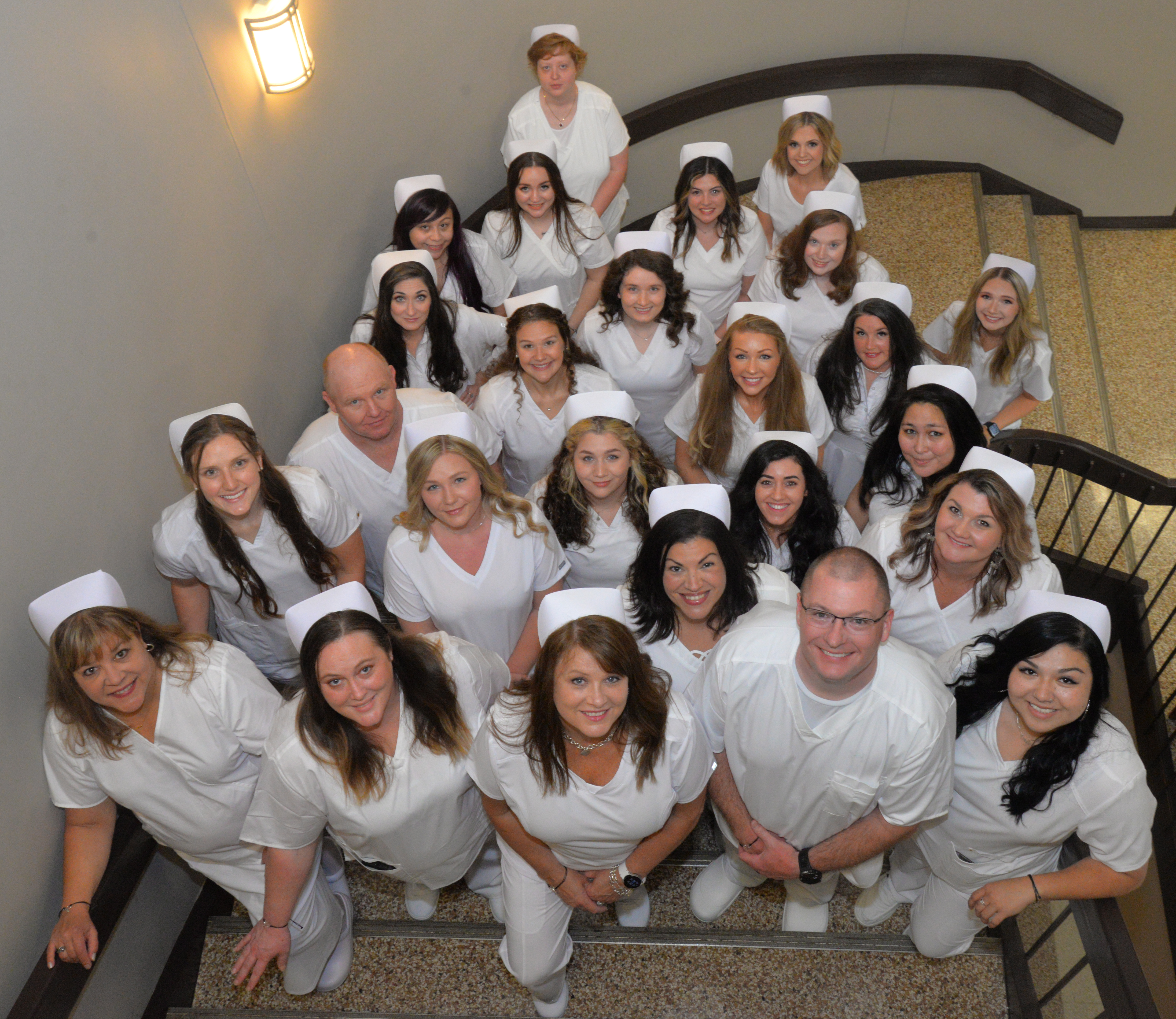 All 25 May graduates of SCC’s Nursing program recently passed their licensure exams. Pictured here are, front row, from left: Beth Bunting of Franklin, Jessica Rodmaker of Bryson City, Patricia Buchanan of Sylva, Amanda Patterson of Robbinsville, David (Nic) Cook of Leicester and Alexandria Patterson of Robbinsville. Second row: Kaitlyn Putnam of Sylva, Daphney Brinkman of Franklin, Amber Sellino of Franklin, Cory Suppa of Bryson City and Rebecca Green of Franklin. Third row: Charles Smith of Robbinsvile, Kari Putnam of Sylva, Ashley Buchanan of Franklin, Hayley Moralez of Franklin and Katie Moore of Waynesville. Fourth row: Hillary Foster of Almond, Deanah Smith of Whittier, Sarah Brown of Greensboro and Kennedy Sorrells of Canton. Fifth row: Jennifer Carey of Cherokee, Leah Carter of Franklin, Elizabeth Cartwright of Canton and Kassandra Matthews of Bryson City. Back row: Melissa Quiletorio of Franklin.