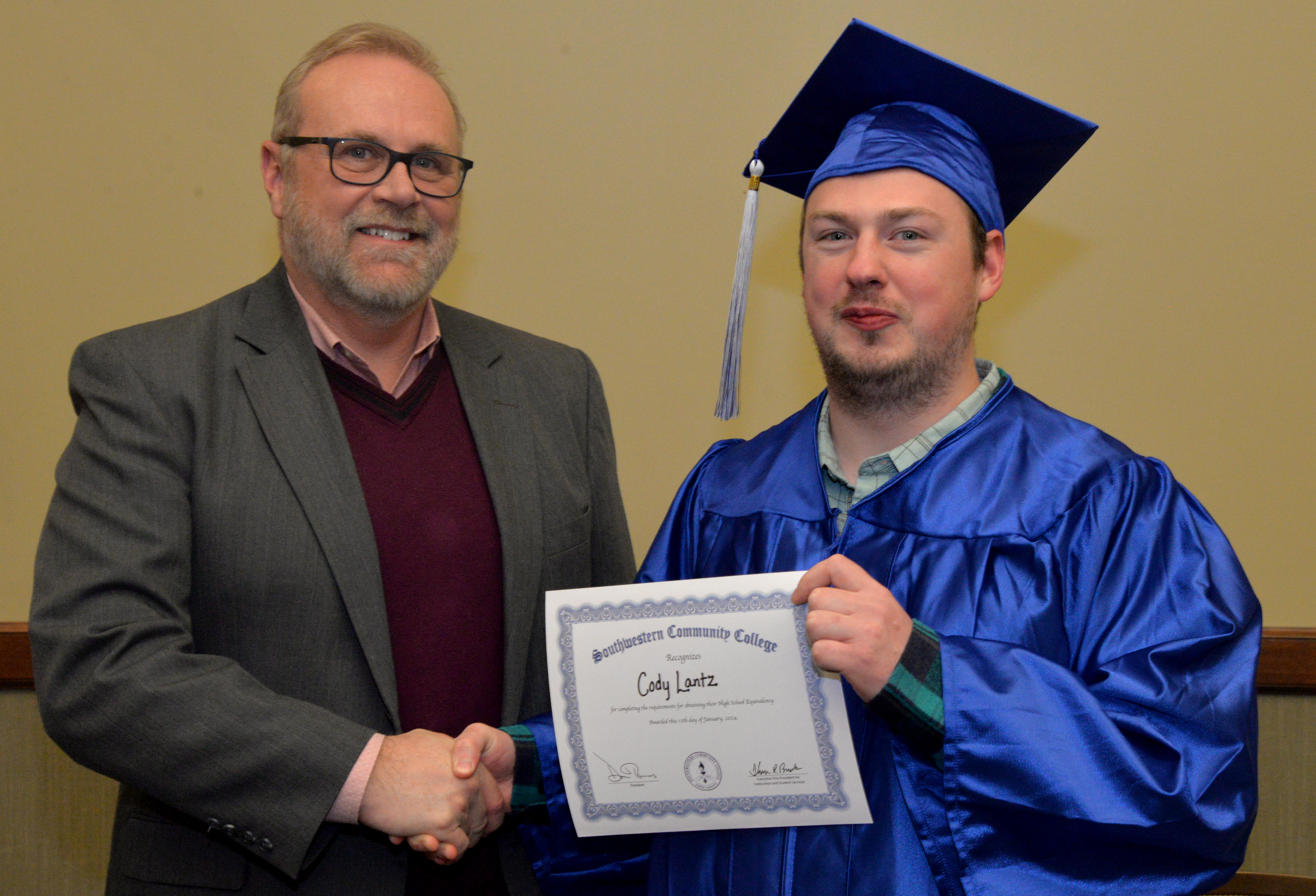 student receives diploma