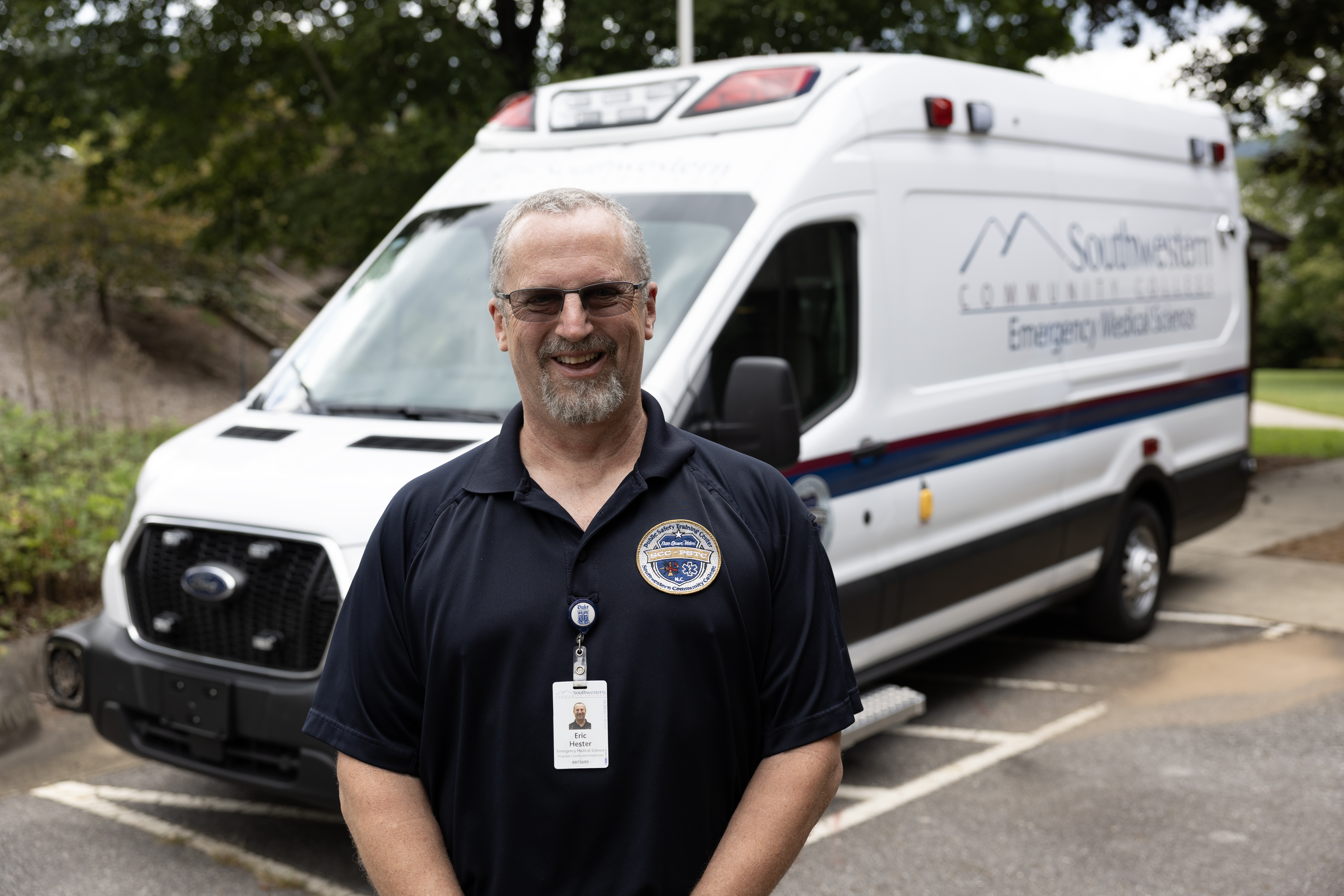 Eric Hester stands in front of ambulance