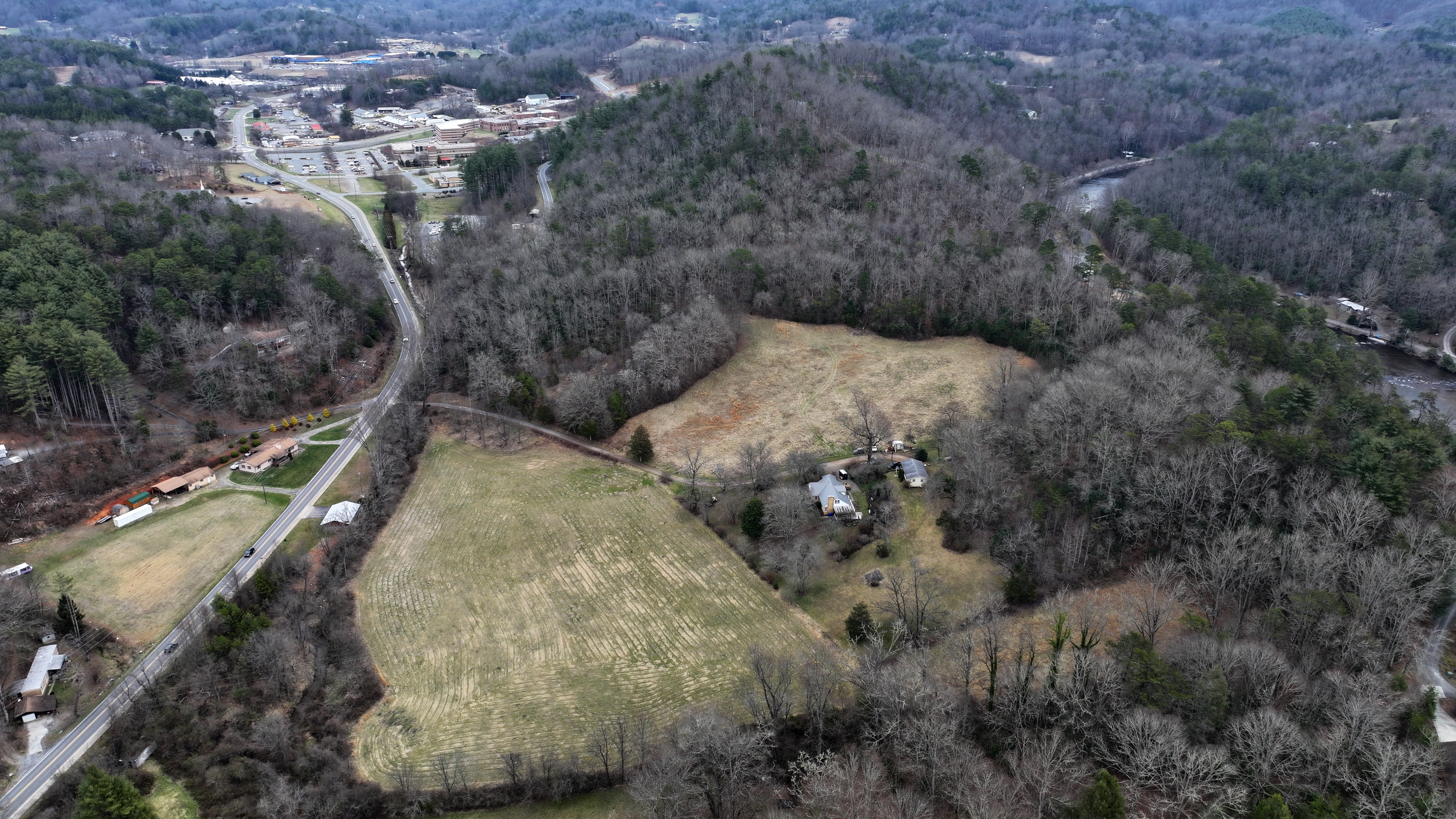 Photo of new land with SCC's Jackson Campus in the background