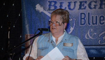 Photo of Dr. Lynn Dillard speaking at a microphone.