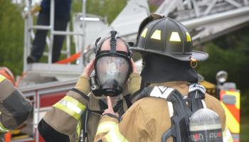 Firemen prepare their gear before a training exercise