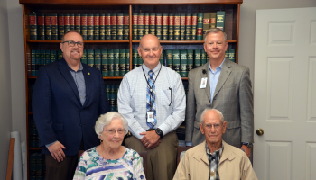 Former Macon County Sheriff George Moses (front right) and his wife Margaret (front left) recently endowed a new scholarship fund for Basic Law Enforcement Training through the Southwestern Community College Foundation. Pictured behind the couple are from left: Dr. Thom Brooks, Executive Vice President for Instruction and Student Services at SCC; Curtis Dowdle, SCC’s Dean of Public Safety Training, and Brett Woods, Director of the SCC Foundation.