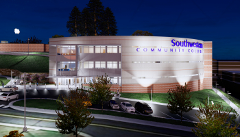 Artist's rendering of the new building, shown at night, three story structure with several parking spots out front.