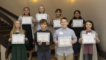 Walking across the same stage on which they’ll one day receive their college degrees, seventh graders from Jackson, Macon and Swain Counties were inducted into the New Century Scholars program on Wednesday, Nov. 12 in Myers Auditorium on Southwestern Community College’s Jackson Campus.