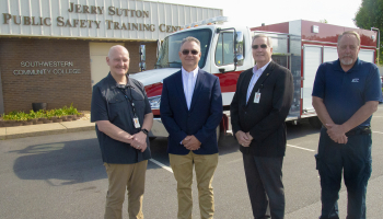 N.C. Rep. Karl Gillespie (second from left) recently helped Southwestern Community College secure more than $350,000 to purchase a new fire truck for its Public Safety Training Center in Franklin. Pictured with Gillespie are, from left: Curtis Dowdle, SCC’s Dean of Public Safety Training; Dr. Don Tomas, SCC President; and Alan McWilliams, SCC’s Fire/Rescue Program Director.