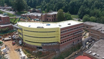 A large brick building is being constructed