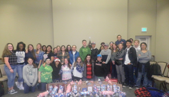 Group of students with gifts the had for members of the community