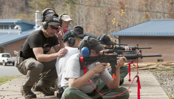 Instructor gives tips to shooter during a recent training at SCC's firing range.
