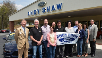 people standing at andy shaw ford