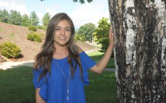 Woman stands outdoors on SCC's Jackson Campus