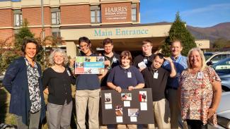 Group of people stand outside of hospital in Sylva.