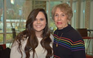 Two ladies pose for a photo inside SCC's Burrell Building in Sylva.