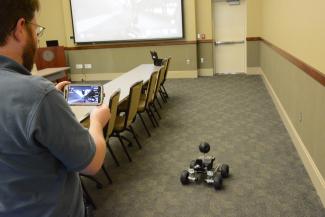 Scott Mitchell showing how his SWAT robot works