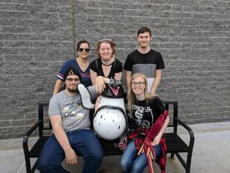 five students sitting