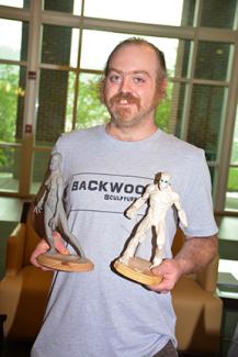 Two young ladies light candles during the ceremony.