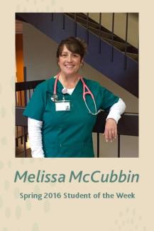 Melissa McCubbin wearing her green scrubs and pink stethoscope