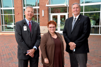 Nancy Bergenstock stands beside Brett Woods and Dr. Don Tomas.