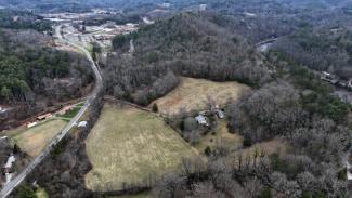 Photo of new land with SCC's Jackson Campus in the background.