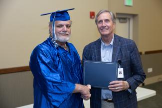 Larry Prowant receives his certificate from SCC's President