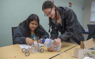 Experanza Rangel (left) and Chlor Tarter work together on the “Fuel Cell Hydrogen Car” challenge during the sixth annual Science, Technology, Engineering and Math (STEM) event on April 14 at SCC’s Macon Campus in Franklin.