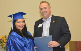 girl receiving diploma