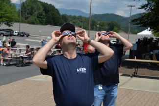 SCC employees observe the 2017 solar eclipse through solar glasses