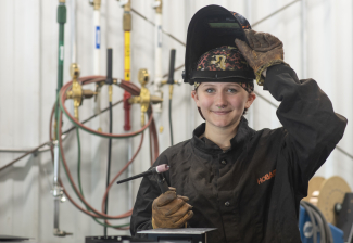 female with welding mask