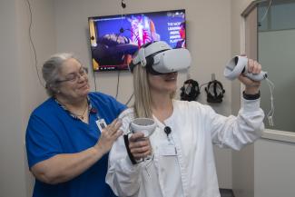Jill Ellern, SCC’s Director of Healthcare Simulation Learning, shows Nursing student Mandy Tessin how to use some of the new virtual reality headsets located in the Don Tomas Health Sciences Center on Southwestern’s Jackson Campus.