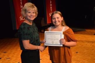Jackson County student receives New Century Scholars induction certificate from superintendent