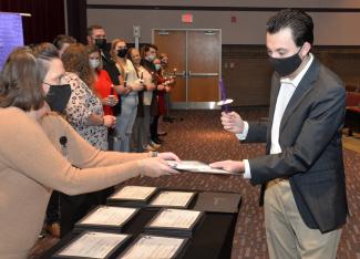 Student receives certificate