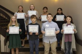 Walking across the same stage on which they’ll one day receive their college degrees, seventh graders from Jackson, Macon and Swain Counties were inducted into the New Century Scholars program on Wednesday, Nov. 12 in Myers Auditorium on Southwestern Community College’s Jackson Campus.