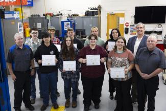 SCC students stand with instructors and college officials