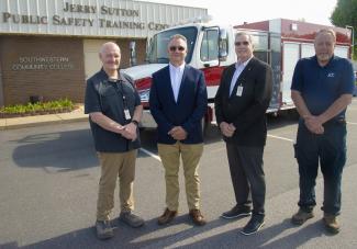 N.C. Rep. Karl Gillespie (second from left) recently helped Southwestern Community College secure more than $350,000 to purchase a new fire truck for its Public Safety Training Center in Franklin. Pictured with Gillespie are, from left: Curtis Dowdle, SCC’s Dean of Public Safety Training; Dr. Don Tomas, SCC President; and Alan McWilliams, SCC’s Fire/Rescue Program Director.
