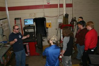 Students gathered around new equipment at Franklin High School