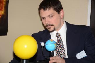 Matt Cass demonstrates how a solar eclipse works