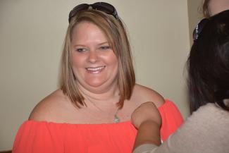 Photo of medical assisting student receiving her pin.