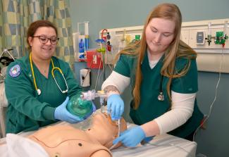 Kristin Farmer (right), a 2022 SCC Respiratory Therapy graduate from Canton, and her former classmate, Kendra Hall of Cullowhee, are shown here in one of Southwestern’s simulation labs. Southwestern is partnering with Blue Ridge Community College to offer Respiratory Therapy in Transylvania County.