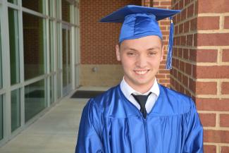 Graduate in cap and gown