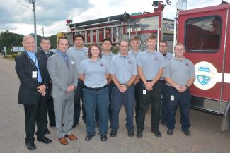 SCC Fire Academy graduates standing in front of fire truck.