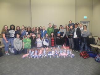 Group of students with gifts the had for members of the community