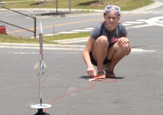 Girl launching her rocket