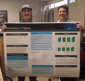 man and woman stand behind poster