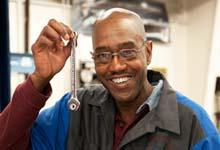 Photo of Stanley Kingsberry holding magnetic wrench